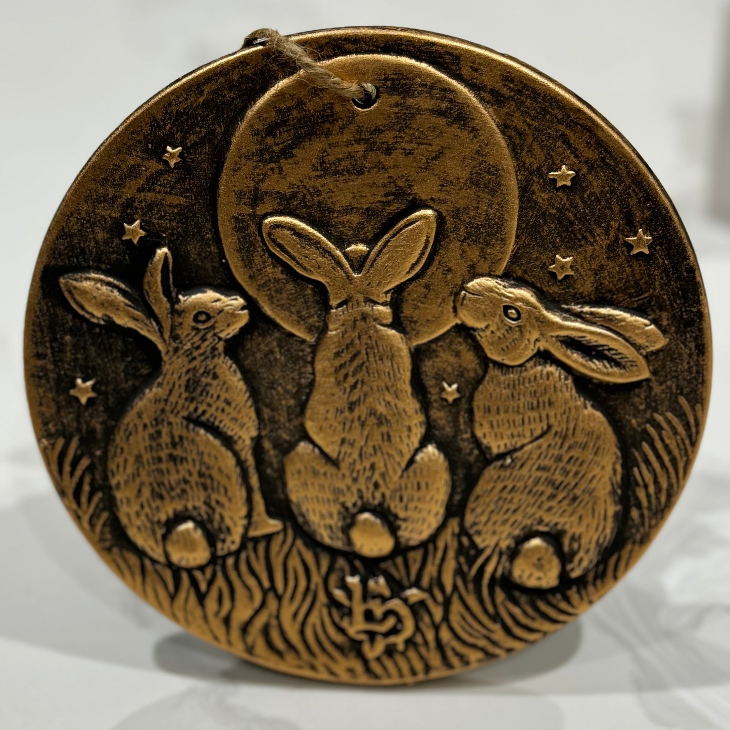3 rabbits and moon terracotta plaque