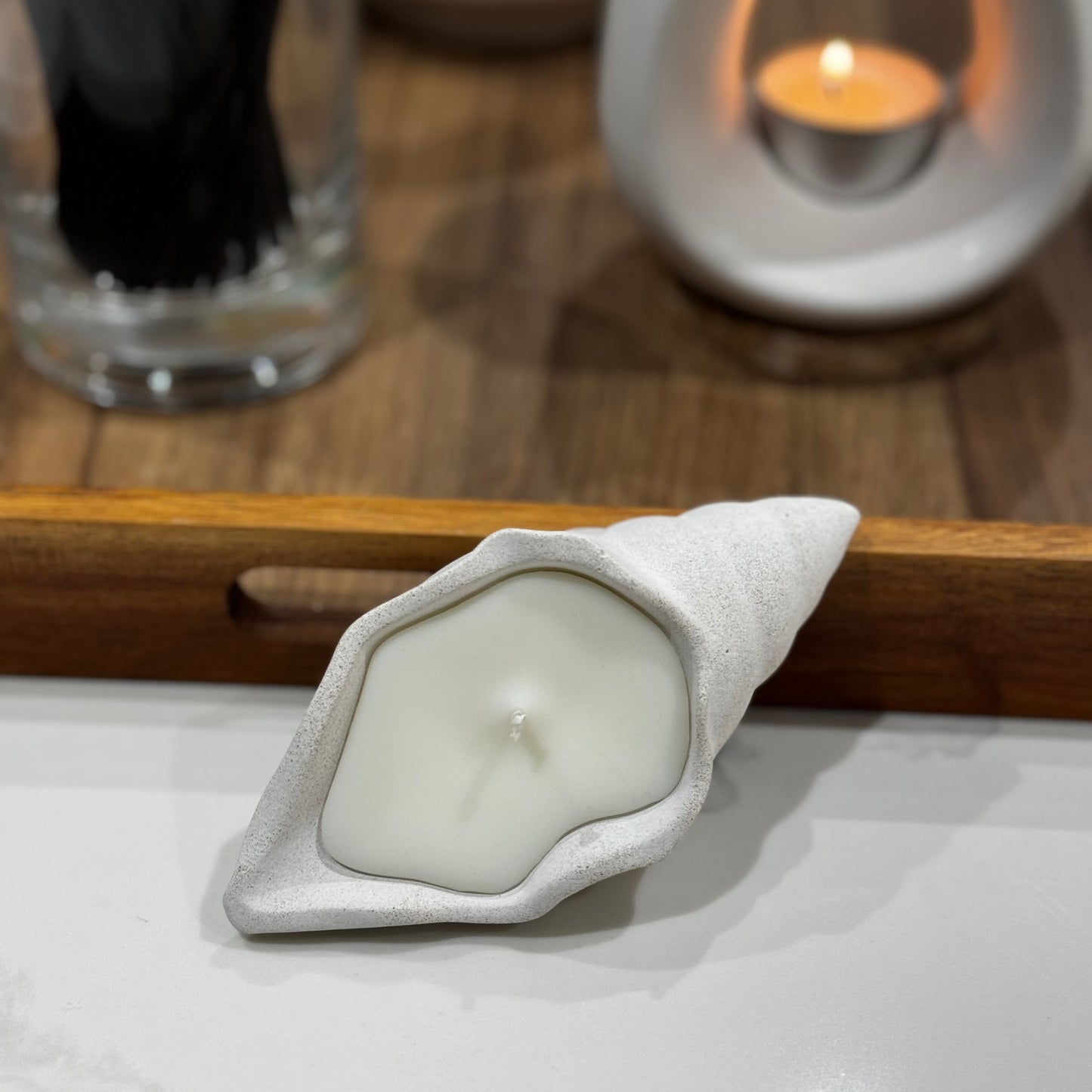 Small seashell candle with stone outer 