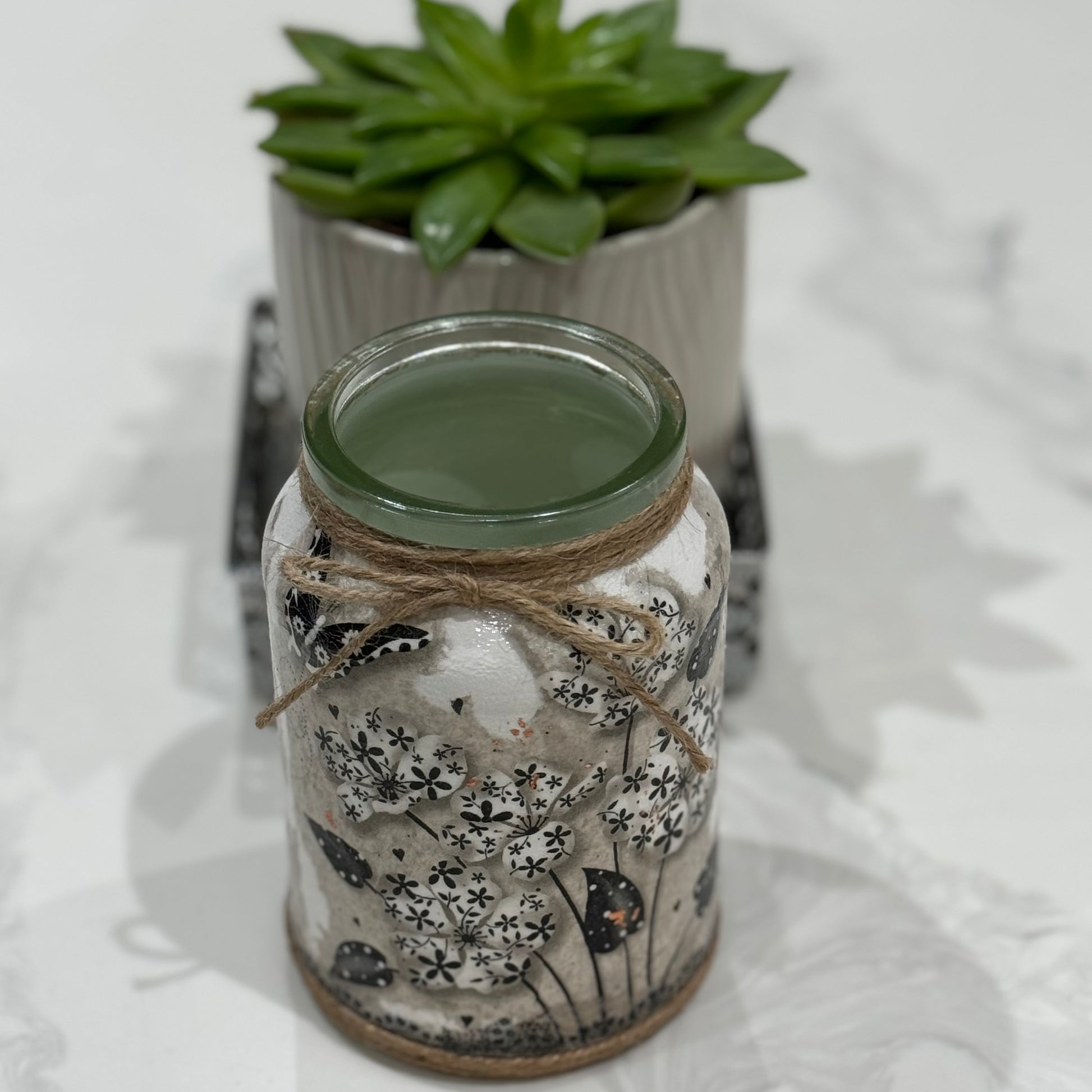 Black and white flowers and butterfly glass jar 